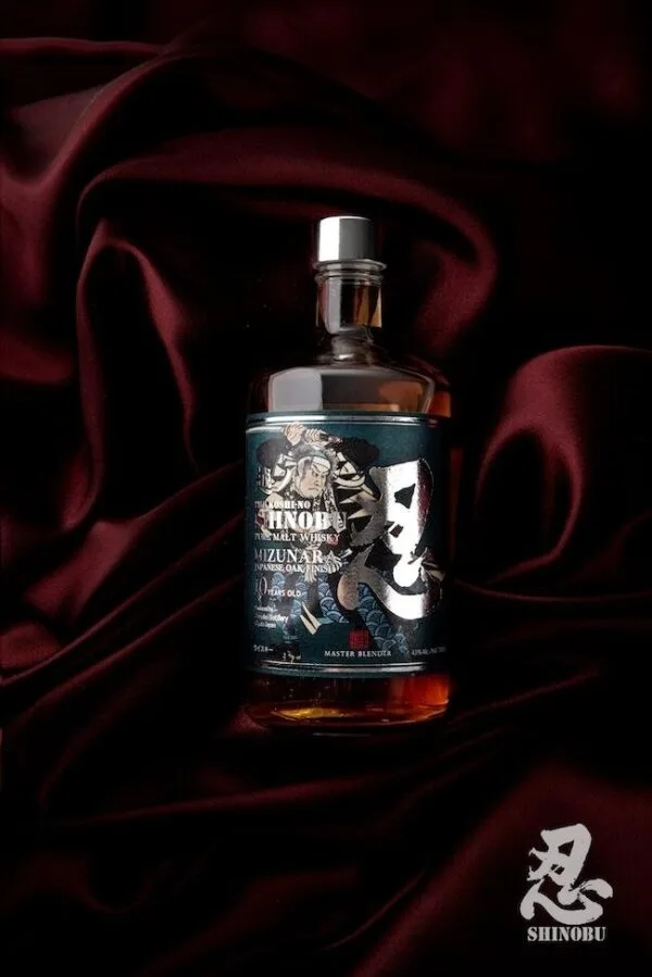 A bottle of the Shinobu Pure Malt 10 year old whisky on red velvet