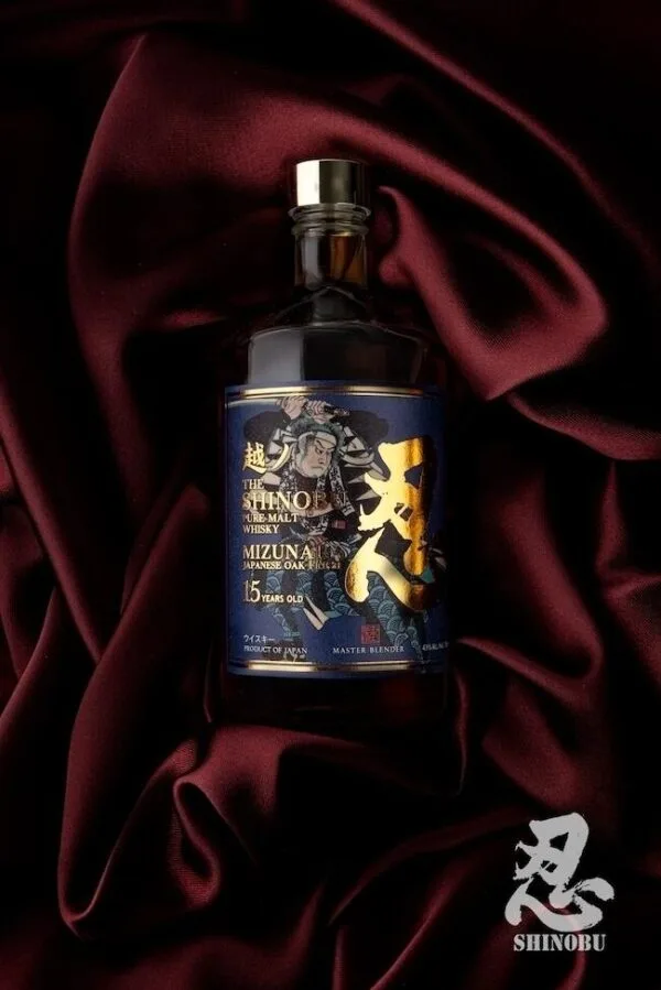 A bottle of the Shinobu Pure Malt 15 year old whisky on red velvet