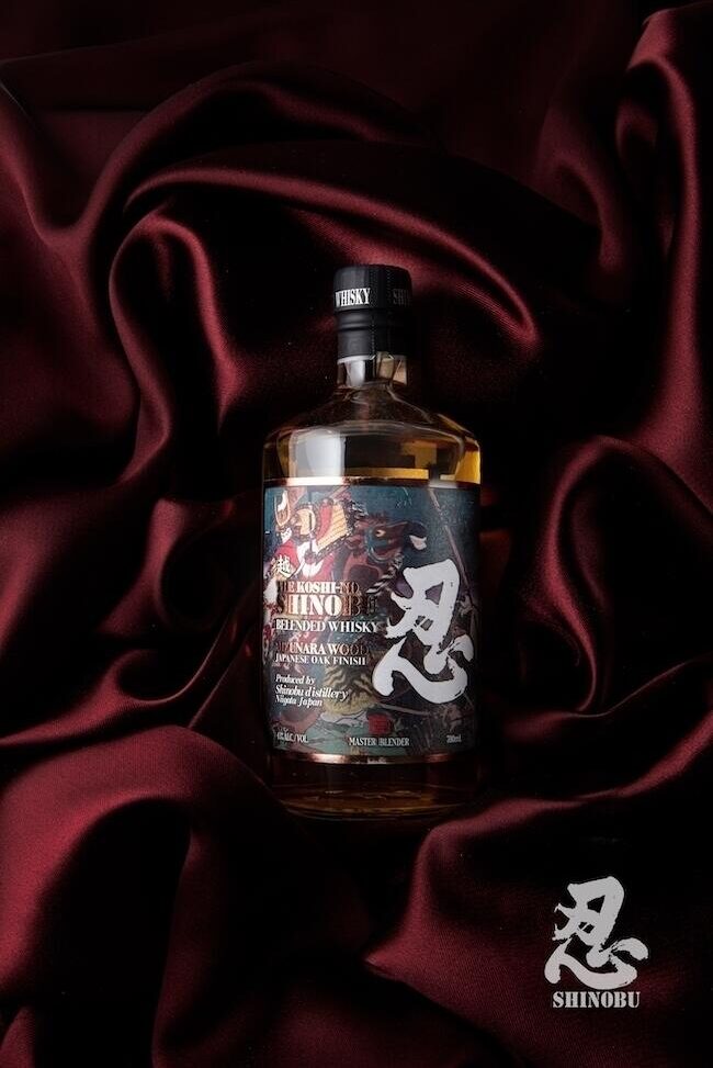 A bottle of the Shinobu blended Japanese Whisky on red velvet