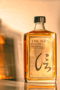 a bottle of the Shin pure malt with a shadow behind