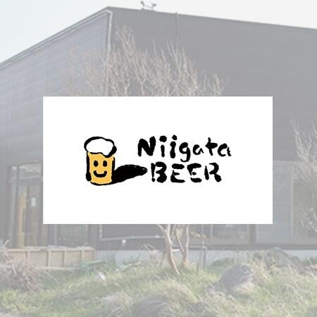 niigata beer logo with a building of Shinobu distillery behind.
